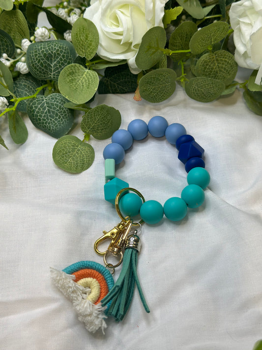 Sea of blue beaded keychain with rainbow and tassle