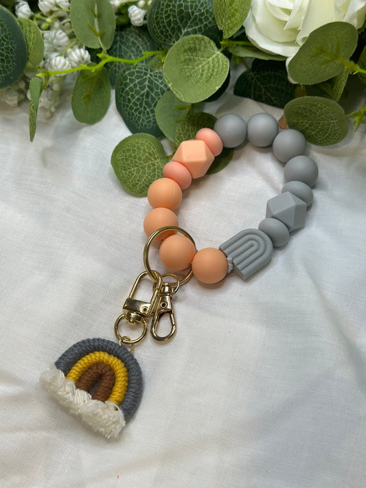 Peach and grey rainbow beaded keychain